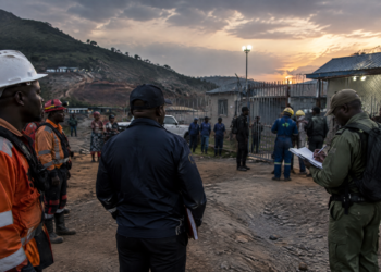 Investigators and rescue workers at a Nigerian mining-community holding facility