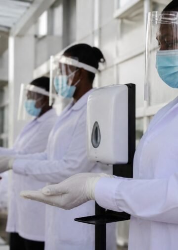 Health workers in protective gear at a hospital screening point in Nigeria